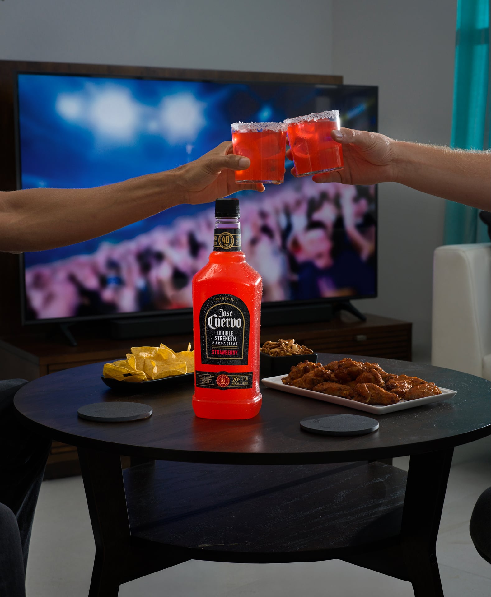 Toasting with Jose Cuervo Double Strength Strawberry Margarita ready-to-drink cocktail in glasses